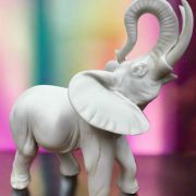 White Bonded Marble statue of elephant with trunk up in the air 