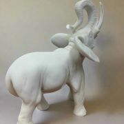 White Bonded Marble statue of elephant with trunk up in the air 